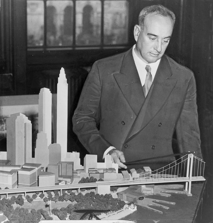 Robert Moses with a model of the Battery Bridge. Image via Wikimedia.