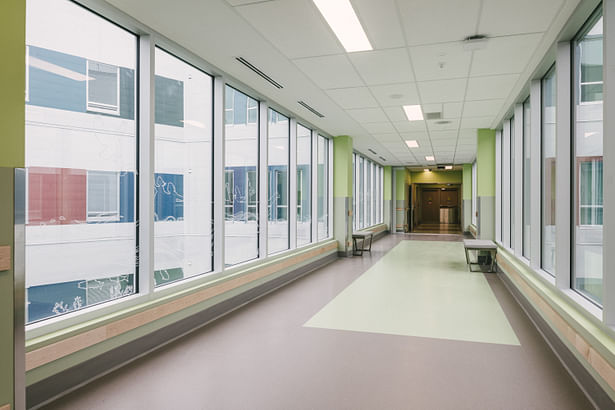 Long hallways allow an abundance of natural light into the facility. (Courtesy Parkin Architects)