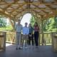 Clemson University graduate students Baker Roddy, John Ownes, Mia Walker, and Michaela Chrisman stand in a bridge pavilion they designed and constructed in one semester for the Architecture+communityBUILD program certificate.