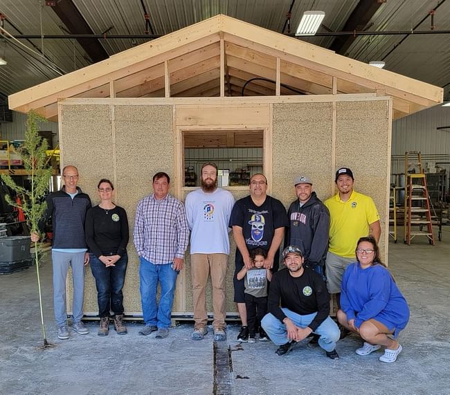 Hempcrete team in front of model-house via https://lowersioux.com/hemp-program-and-housing-project/