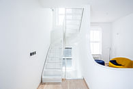Curved stairs with perforated steel mesh - London
