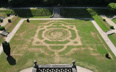 The scorched lawns at Gawthorpe Hall, Lancashire, have revealed the outlines of the 19th-century Victorian garden which was removed in 1946.