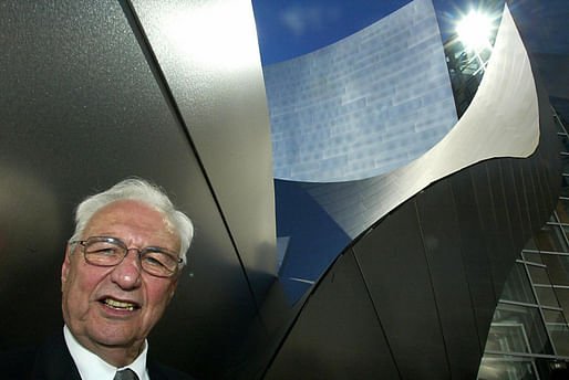 Architect Frank Gehry poses near the entrance of the Walt Disney Concert Hall during a dedication celebration, 20 October 2003, in Los Angeles. The building will house the Los Angeles Philarmonic and is in its final preparations for the opening gala 23 October 2003. (Caption: KPCC, photo: HECTOR...