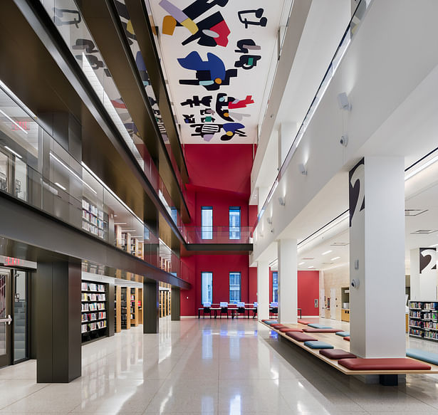 A triple height void has been cut into it, 9m (31 feet) wide and rising 26m (85 feet) from the second story to a vibrant new abstract ceiling artwork by Hayal Pozanti. Image copyright by John Bartelstone