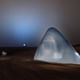 Mars Ice House is 3d printed from translucent ice which shields the crew from radiation, and transforms into a glowing beacon in the Martian night. Image © CloudsAO / SEArch.