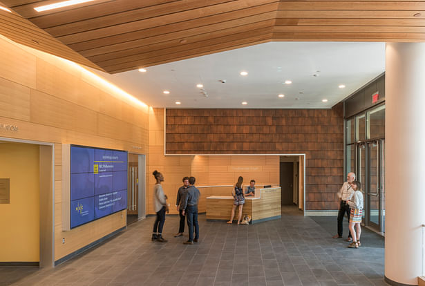 Terracotta tiles bring warm earth tones and echoes of the façade into the spacious lobby. Photo credit: Peter Vanderwarker