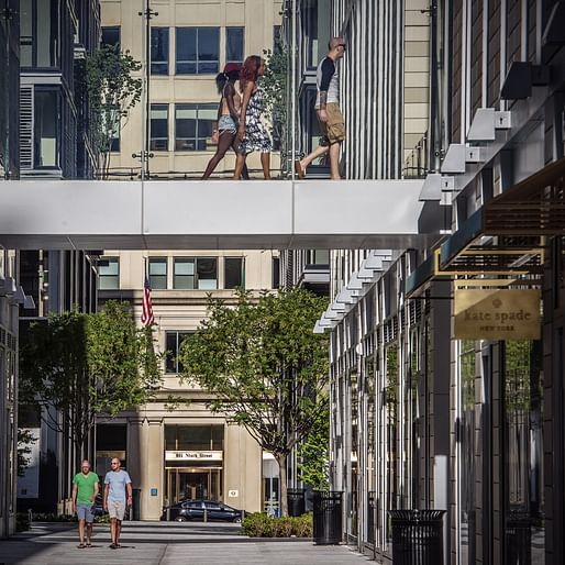 Pedestrians pass overhead and on street level near the new Kate Spade shop at CityCenterDC. (Bill O'Leary/Washington Post)