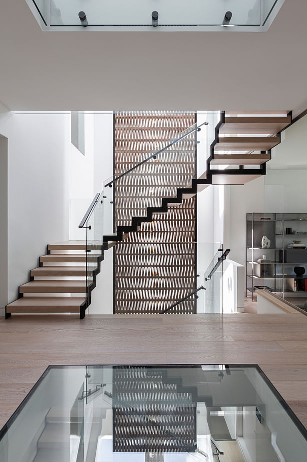 Atelier RZLBD / Stacked House / staircase, terracotta screen, glass floor
