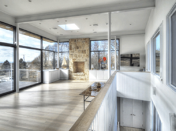 The living/ dining area opens up to a patio with beautiful ocean views.