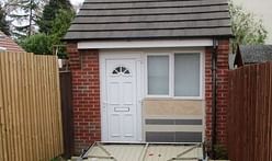 Couple fined for using a fake garage door to disguise a residential property