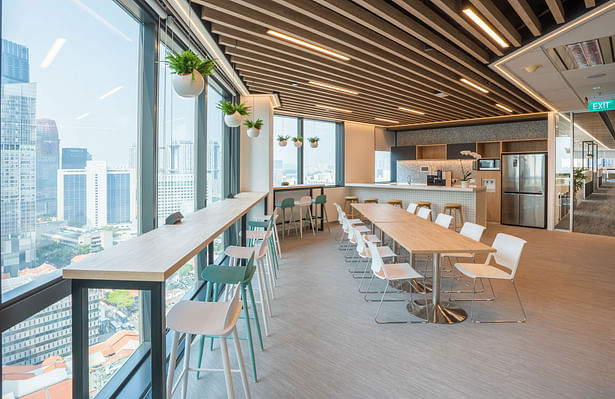 Corporate office interior design of Forrester Singapore - Pantry in light colours with a view, designed by Space Matrix