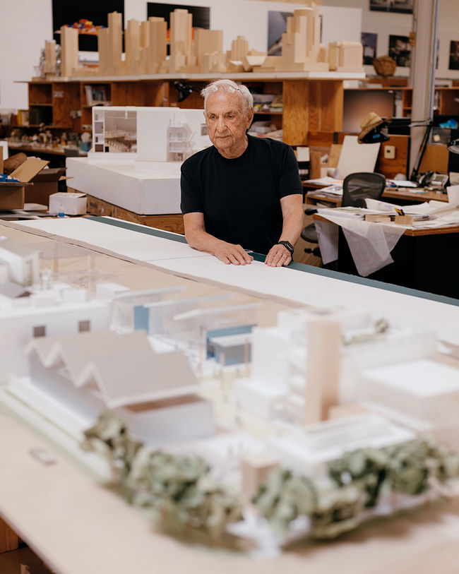 Gehry with a design model of the SELA Cultural Center, in South Gate, Calif; photo by Erik Carter for The New York Times