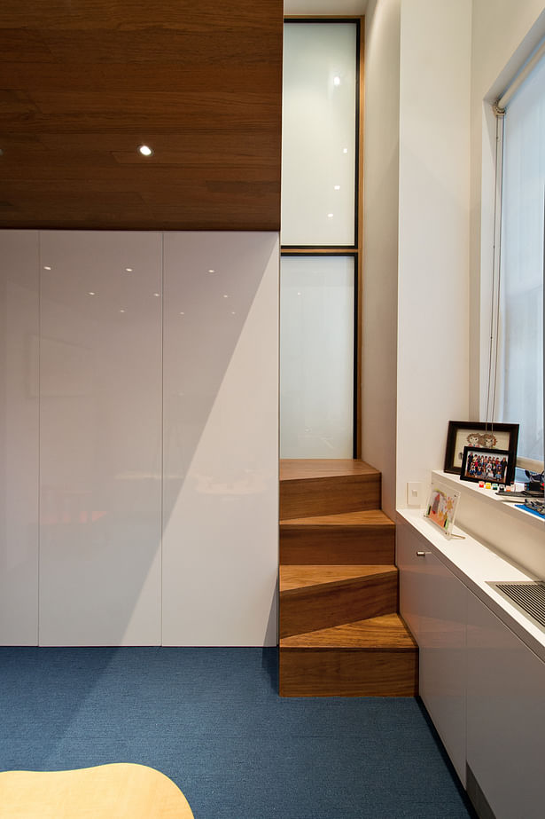 The Alternating Treads Stair Playfully Pokes Out into the Playroom