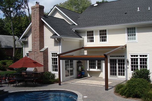 The Gennius Pergola Awning with cover and solar shade retracted