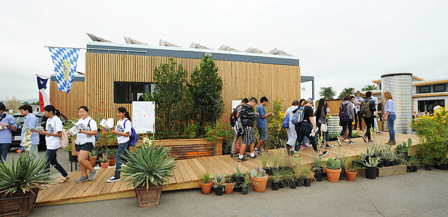 Education Days students tour the University of Texas at Austin and Technische Universitaet Muenchen house at the Orange County Great Park, Irvine, California, Oct. 15, 2015 (Credit: Thomas Kelsey/U.S. Department of Energy Solar Decathlon)