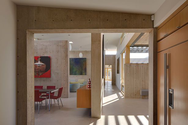 View from kitchen toward entry hall on right and dining and living spaces on the left. Image: Robert Reck