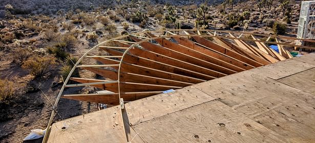 Each rafter is cut at a differing compound angle to build the ellipse shape.