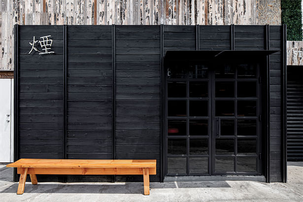The Shou Sugi Ban Siding juxtaposes the existing building, creating a wonderful contrast. The facade gently conquers its surroundings and creates a noticeable language for nearby residents to stumble into a piece of Japan in their community.​