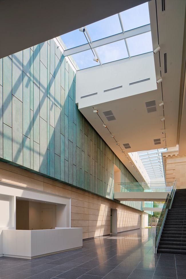 A new light-filled atrium welcomes Museum visitors. The admission desk is located to the left of the staircase that leads to the upstairs galleries. The bridges that join the historic Richard M. and Elizabeth M. Ross building and the new Margaret M. Walter Wing.