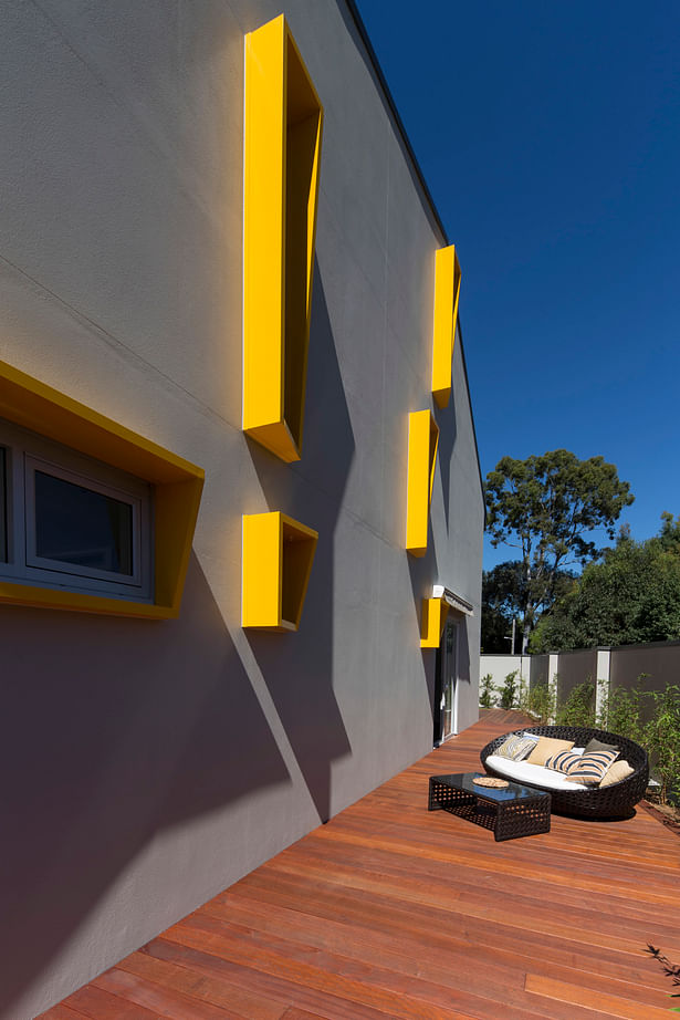 The bright sculpted sun shading makes for a lively side elevation.