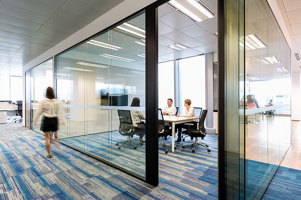 Glass walls and chain link partitions further highlight the accessible, straightforward nature of their operations - City Facilities Management in Hong Kong by Space Matrix