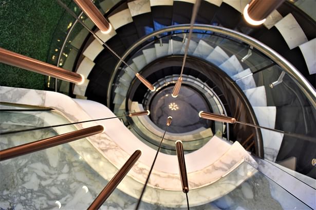 Luxurious amalgamation of staturio marble and teak wood for staircase - A.J Architects