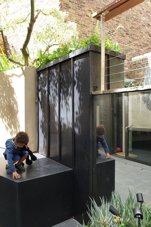 Weathered copper & mirrors used for overscaled planters