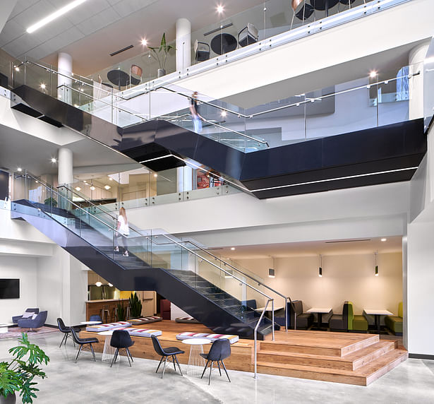 The Agency's Atrium was reimagined as the heart of the agency — an area with glass-fronted conference rooms and tucked away “havens” that formed a dynamic and versatile workplace. Image Credit: Keith Isaacs