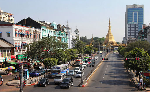 At the center of Yangon, the city's colonial heritage, Buddhist faith and emerging modern face are visible in a single block. (Frank Langfitt/NPR)