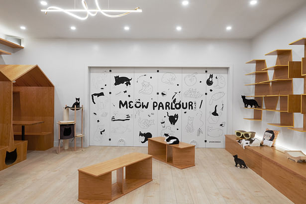 A stunning graphics on the folding wall between the two lounge spaces illustrate the Meow Parlour staff's favorite cats or pets -- an homage of sorts!