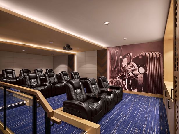 The cinema features modern furniture, light wood, acoustic baffles, and tiered seating with ample room to move throughout the rows. (photo by Will Pryce)