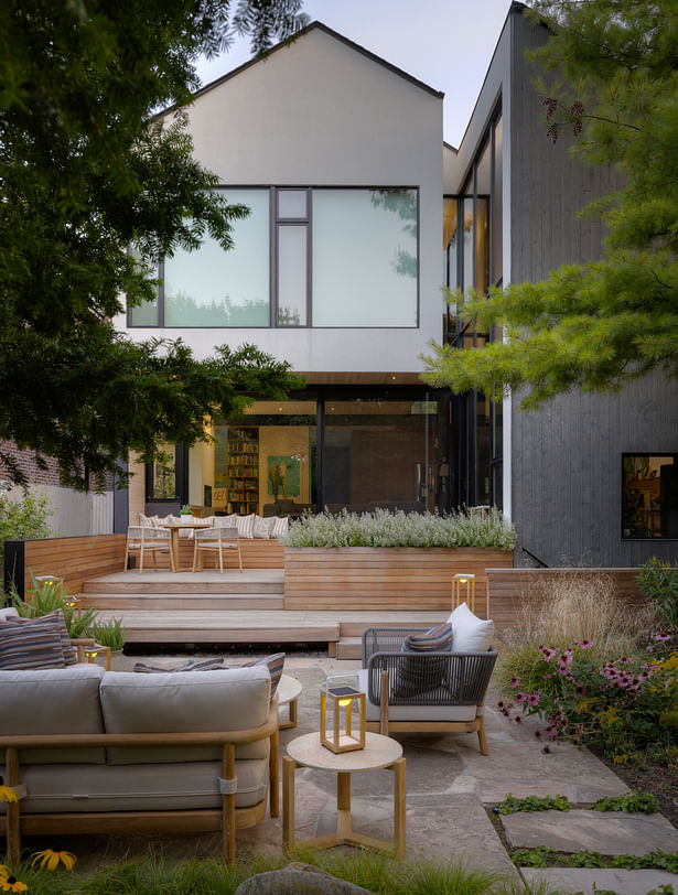 Patios and decks are surrounded by and interlaced with planting