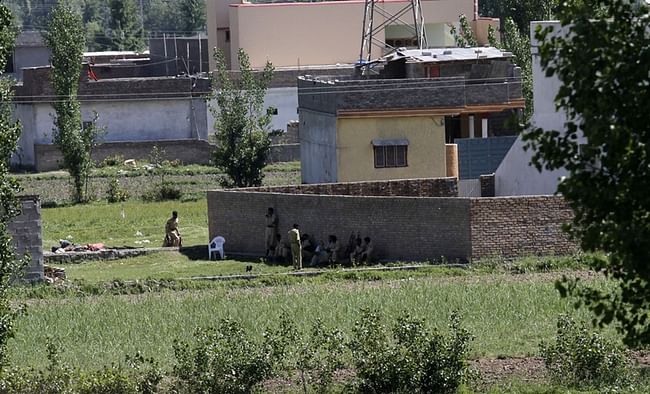 Anjum Naveed / AP Pakistan army soldiers rest near the house where it is believed al-Qaida leader Osama bin Laden lived in Abbottabad, Pakistan on Monday, May 2.