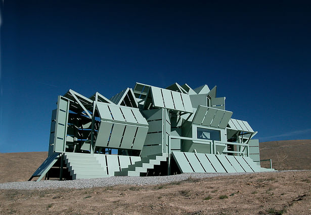 The M-house, a modular, prefabricated, transformable building system that can change its shape to accommodate changing needs, built in 2000.