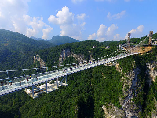 The bridge, designed by Israeli architect Haim Dotan, spans across the Zhangjiajie Grand Canyon in China's Hunan province. (Image: Visual China Group/Getty Images via npr.org)