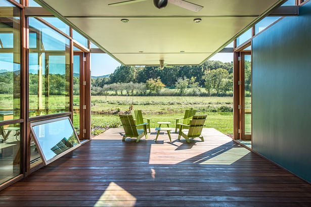 A dog trot entry separates the living area to the left from guest quarters, exercise, shop and garage to the right. The dogtrot faces due south toward the site's future agricultural fields and the national forest beyond. Fredrik Brauer