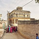 A wedding party brightens up the streets of Mahansar. The Tolaram Haveli — the inside of which is dazzlingly painted — is in the background. Credit Nick Ballon