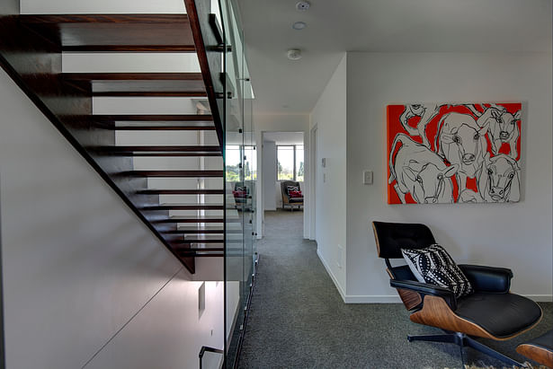 The brightly lit stair well and second living area.