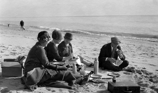 A 1925 photo of picnickers sitting on the Santa Monica shoreline. Image via Homestead Museum.