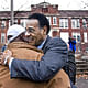 Before a Monday news conference at the Bancroft School site, Rep. Emanuel Cleaver embraced Mike Richardson, who lives near the school. 