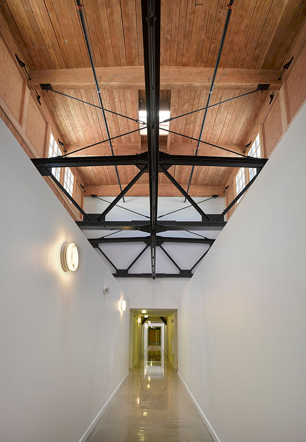 Hallway with clerestory and preserved industrial breakers