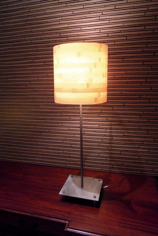 A Bamboo veneer hoop light on an aluminum base with allen style hardware. 28' x 13' x 13' 