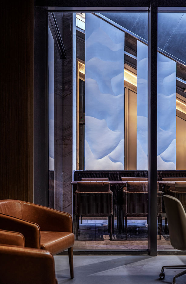 An office room with a view of the “waterfall” by One Thousand Degree Visual