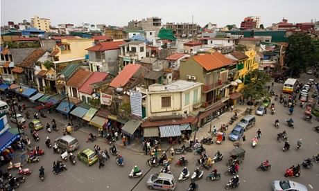 Hanoi can feel like a series of villages that have melded together, stitched by honking, careening streets into a single unit. (The Guardian; Photograph: Prisma Bildagentur/Alamy)