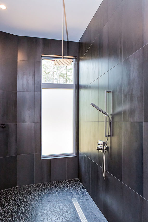 Frosted glass allows sunlight into the shower without sacrificing privacy.