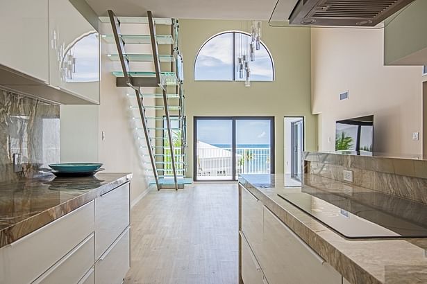 Center-beam Staircase Featuring Frosted Glass Treads & Clear Glass Railings