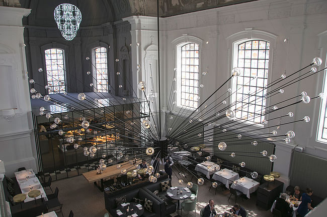 .PSLAB's chandelier at The Jane restaurant, housed in a former chapel for a military hospital in Antwerp, Belgium. Photo courtesy of .PSLAB.