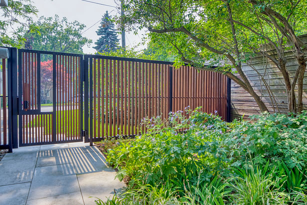 View of fence and gate from garden interior