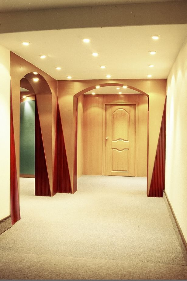 The corridor walls are light colored to increase visual space