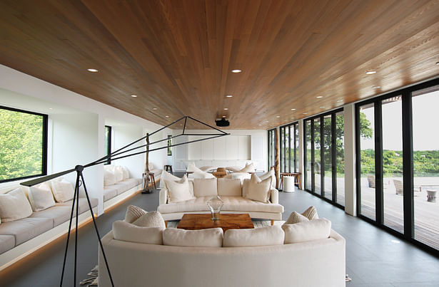 Open Entertaining Space on Main Level of Guest Wing with Wall of Folding Glass Doors to Pool Deck